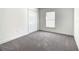 Cozy bedroom with plush carpeting, a window with natural light, and a closet at 438 Jay Ct, Kissimmee, FL 34759