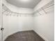 Walk-in closet with metal shelving and neutral carpet at 438 Jay Ct, Kissimmee, FL 34759
