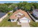 Aerial view of a well-maintained single-Gathering home with a spacious yard and an attached two-car garage at 438 Jay Ct, Kissimmee, FL 34759