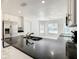 Modern kitchen featuring stainless steel appliances, granite countertops, and an open concept design for easy entertaining at 438 Jay Ct, Kissimmee, FL 34759