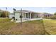 Backyard with screened patio and basketball hoop at 511 Cardinal Dr, Kissimmee, FL 34759