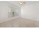 Well-lit bedroom featuring tile flooring and window at 511 Cardinal Dr, Kissimmee, FL 34759