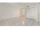 Spacious bedroom with tile floors and access to bathroom at 511 Cardinal Dr, Kissimmee, FL 34759