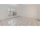 Bright bedroom with tile flooring and large window at 511 Cardinal Dr, Kissimmee, FL 34759