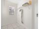 Laundry room with shelving and window at 511 Cardinal Dr, Kissimmee, FL 34759