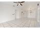 Spacious living room with tile floors and a ceiling fan at 511 Cardinal Dr, Kissimmee, FL 34759