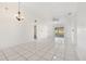 Bright living room with tile floors and sliding glass doors at 511 Cardinal Dr, Kissimmee, FL 34759