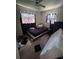 Modest bedroom with fair natural light and hard wood floors at 589 Duncan E Cir, Auburndale, FL 33823