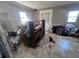 This bedroom needs a new look and features tile flooring and natural light from two windows at 589 Duncan E Cir, Auburndale, FL 33823