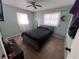 Bright bedroom with two windows and neutral paint at 589 Duncan E Cir, Auburndale, FL 33823