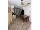 Eat in kitchen featuring stainless steel appliances, tiled flooring, and wooden cabinetry at 589 Duncan E Cir, Auburndale, FL 33823