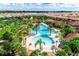Community pool with surrounding lounge chairs and palm trees at 7638 Oakmoss Loop, Davenport, FL 33837