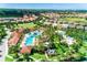 Aerial view showing resort-style pool and community amenities at 7638 Oakmoss Loop, Davenport, FL 33837