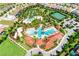 Aerial view of community pool, water park, and tennis courts at 7638 Oakmoss Loop, Davenport, FL 33837