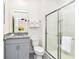 Bathroom with granite vanity and shower at 7638 Oakmoss Loop, Davenport, FL 33837
