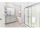 Elegant bathroom with granite countertop, bathtub, and shower at 7638 Oakmoss Loop, Davenport, FL 33837