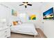 Bedroom with queen bed and calming decor at 7638 Oakmoss Loop, Davenport, FL 33837