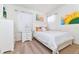 Bedroom with queen bed and neutral decor at 7638 Oakmoss Loop, Davenport, FL 33837
