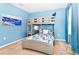 Bedroom with twin-over-full bunk bed, blue walls at 7638 Oakmoss Loop, Davenport, FL 33837