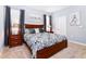 Spacious bedroom with a king-size bed and ample natural light at 7638 Oakmoss Loop, Davenport, FL 33837