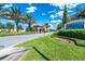 Gated entrance to the community with landscaping and signage at 7638 Oakmoss Loop, Davenport, FL 33837