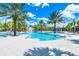 Resort-style pool with water features and palm trees at 7638 Oakmoss Loop, Davenport, FL 33837