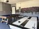 Game room features a pool table and air hockey at 7638 Oakmoss Loop, Davenport, FL 33837