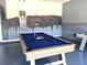 Pool table and air hockey in a fun game room at 7638 Oakmoss Loop, Davenport, FL 33837