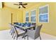 Outdoor dining area on the covered patio at 7638 Oakmoss Loop, Davenport, FL 33837