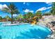 Fun waterpark area with a waterslide and waterfall feature at 7638 Oakmoss Loop, Davenport, FL 33837
