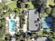 An aerial view of community amenities including a pool, playground, and tennis court at 7658 Whisper Way # 202, Reunion, FL 34747