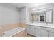 Bathroom boasts double vanity and a relaxing soaking tub at 7658 Whisper Way # 202, Reunion, FL 34747