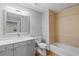 Modern bathroom featuring a bathtub, vanity, and updated fixtures at 7658 Whisper Way # 202, Reunion, FL 34747