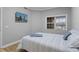 Comfortable bedroom features a window and a TV on the wall at 7658 Whisper Way # 202, Reunion, FL 34747