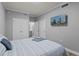 Bright bedroom with neutral paint, a TV, and closet space at 7658 Whisper Way # 202, Reunion, FL 34747