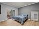 Comfortable bedroom with balcony access and a large mirror at 7658 Whisper Way # 202, Reunion, FL 34747
