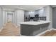 Modern kitchen featuring stainless steel appliances, stone countertops, and a stylish backsplash at 7658 Whisper Way # 202, Reunion, FL 34747