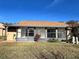 Back exterior of home with sunroom and landscaping at 812 Park Villa Cir, Orlando, FL 32824
