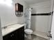 Clean bathroom with shower/tub, toilet and dark vanity at 812 Park Villa Cir, Orlando, FL 32824