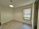Bright bedroom with wood-look floors and a large closet at 812 Park Villa Cir, Orlando, FL 32824