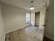 Bright bedroom with wood-look floors and a large closet at 812 Park Villa Cir, Orlando, FL 32824