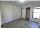 Bright bedroom with wood-look floors and a large closet at 812 Park Villa Cir, Orlando, FL 32824