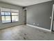 Bedroom with gray accent wall and wood-look tile flooring at 812 Park Villa Cir, Orlando, FL 32824