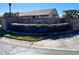 Parkside Villas community entrance with brick wall and landscaping at 812 Park Villa Cir, Orlando, FL 32824