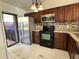 Modern kitchen with stainless steel appliances and granite counters at 812 Park Villa Cir, Orlando, FL 32824