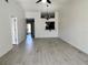 Open living room with tile floors and kitchen pass-through at 812 Park Villa Cir, Orlando, FL 32824