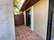 Small tiled patio with sliding glass door access at 812 Park Villa Cir, Orlando, FL 32824