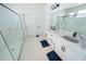 Modern bathroom with a large walk-in shower and double vanity at 9067 Arbors Edge Trl, Windermere, FL 34786
