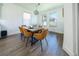 Bright dining room featuring a rustic wood table and comfortable seating at 9067 Arbors Edge Trl, Windermere, FL 34786