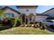 Two-story home with attractive landscaping and a paved driveway at 9067 Arbors Edge Trl, Windermere, FL 34786
